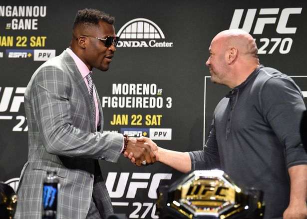 Francis Ngannou and UFC President Dana White shake hands.